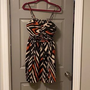 Spaghetti strap dress with pockets.